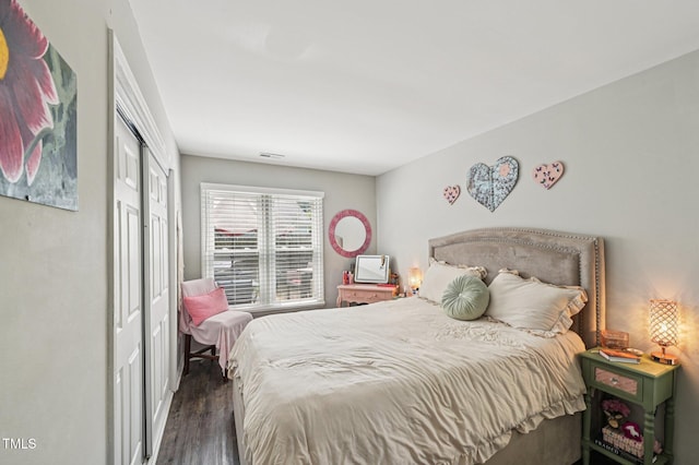 307 Wax Myrtle Ct, Cary, NC 27513 - bedroom featuring dark wood-style floors and a closet
