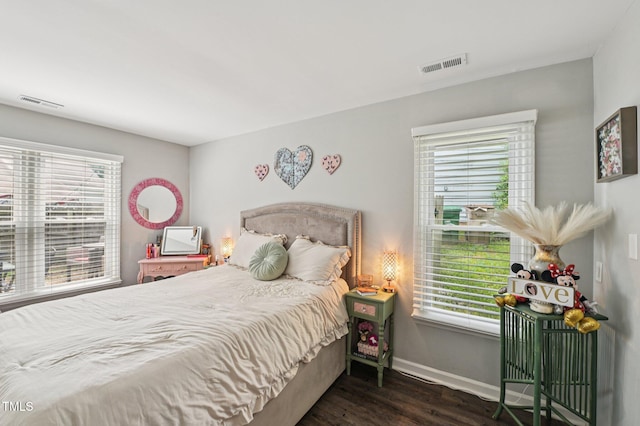 307 Wax Myrtle Ct, Cary, NC 27513 - bedroom featuring wood finished floors and multiple windows