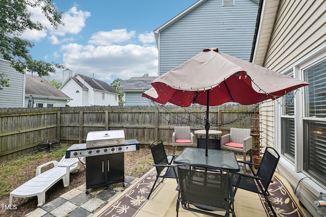 307 Wax Myrtle Ct, Cary, NC 27513 - fenced backyard with outdoor dining space, a grill, and a patio area