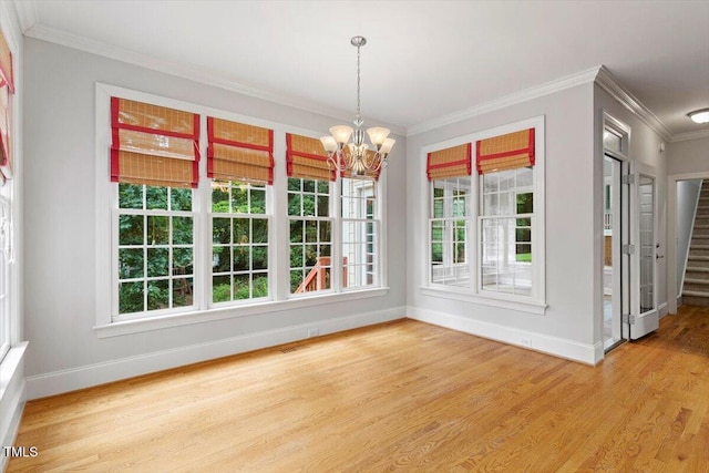 5001 Sears Farm Rd, Cary, NC 27519 - unfurnished dining area with wood finished floors, a chandelier, ornamental molding, and stairway