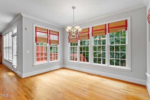 5001 Sears Farm Rd, Cary, NC 27519 - unfurnished dining area with wood finished floors, crown molding, and a chandelier
