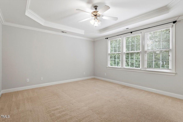 5001 Sears Farm Rd, Cary, NC 27519 - spare room with a raised ceiling, ornamental molding, light carpet, and a ceiling fan