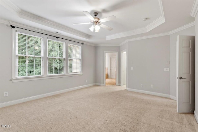 5001 Sears Farm Rd, Cary, NC 27519 - unfurnished bedroom featuring a raised ceiling, ornamental molding, light carpet, ensuite bathroom, and a ceiling fan