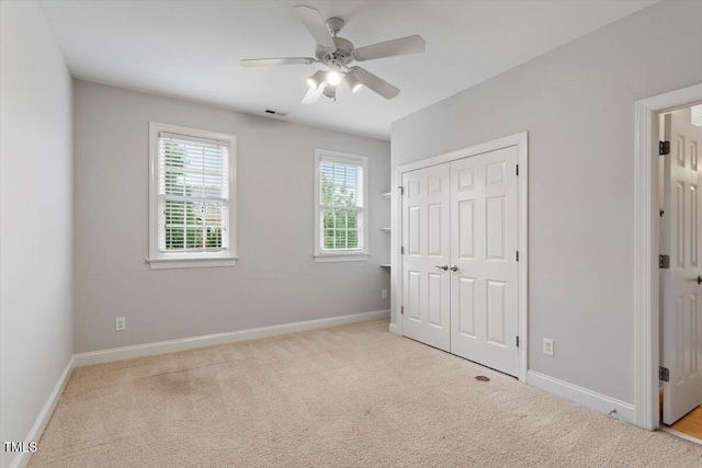 5001 Sears Farm Rd, Cary, NC 27519 - unfurnished bedroom featuring carpet floors, a closet, and a ceiling fan