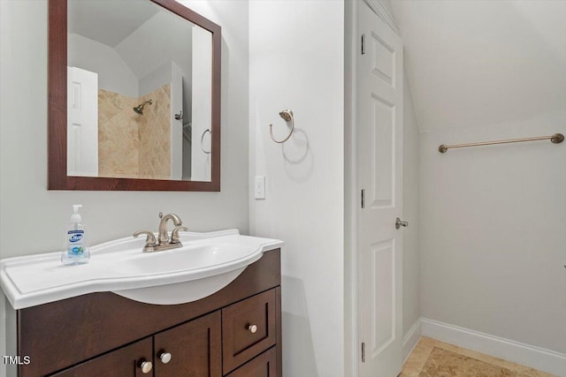 5001 Sears Farm Rd, Cary, NC 27519 - bathroom featuring lofted ceiling, vanity, and a tile shower
