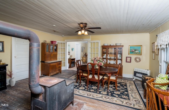 7167 Adolph Rd, Bailey, NC 27807 - dining room featuring heating unit, dark wood-style floors, a ceiling fan, and crown molding