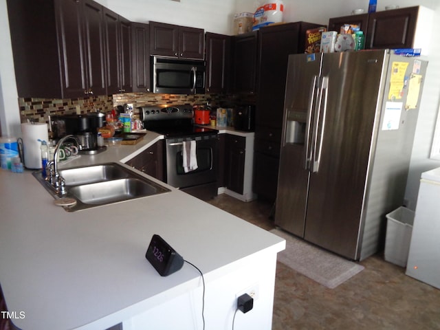 3419 Streams Of Fields Dr, Raleigh, NC 27604 - kitchen featuring stainless steel appliances, light countertops, backsplash, and dark brown cabinetry