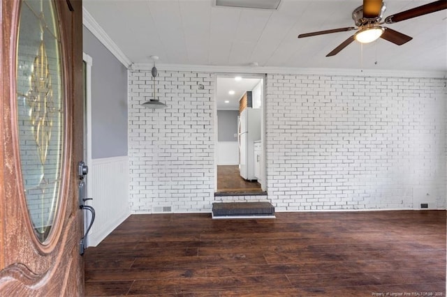 4209 Coventry Rd, Fayetteville, NC 28304 - empty room featuring brick wall, crown molding, wood finished floors, a ceiling fan, and a wainscoted wall