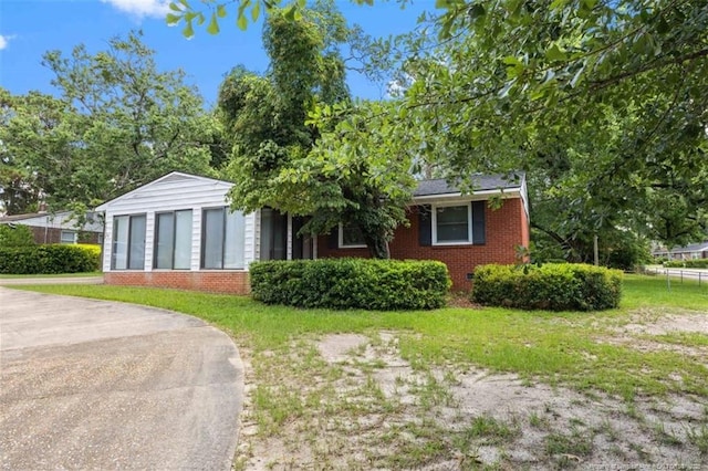 4209 Coventry Rd, Fayetteville, NC 28304 - view of front of house featuring brick siding and a front lawn