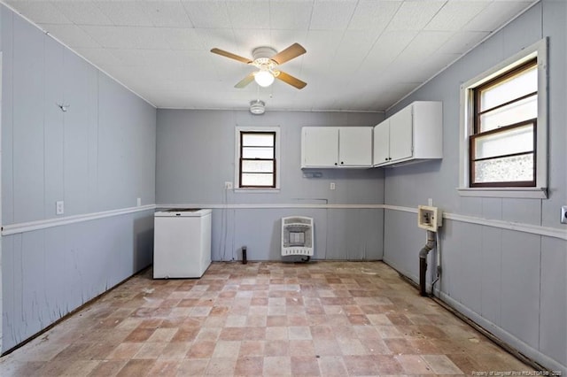 4209 Coventry Rd, Fayetteville, NC 28304 - washroom with heating unit, a ceiling fan, and cabinet space