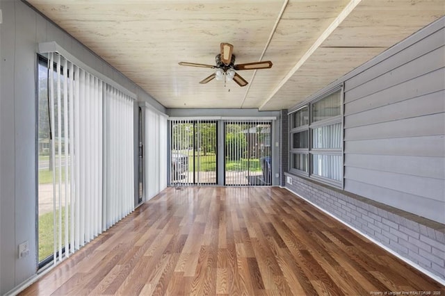 4209 Coventry Rd, Fayetteville, NC 28304 - unfurnished sunroom with a ceiling fan, wood finished floors, wooden ceiling, and brick wall