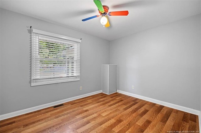 4209 Coventry Rd, Fayetteville, NC 28304 - empty room with wood finished floors and a ceiling fan