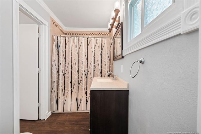 4209 Coventry Rd, Fayetteville, NC 28304 - full bath featuring vanity, ornamental molding, wood finished floors, and curtained shower