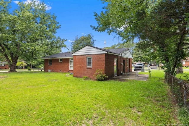 4209 Coventry Rd, Fayetteville, NC 28304 - rear view of house featuring a gate and brick siding