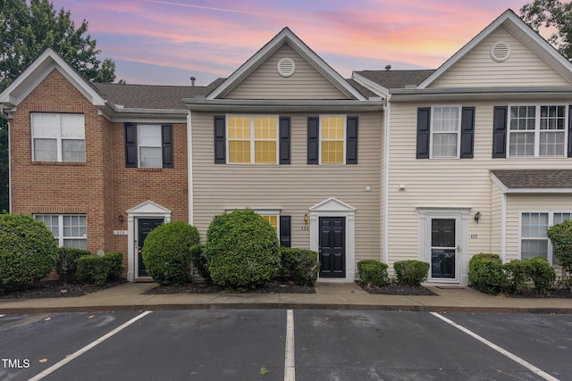 424 Nomar, Raleigh, NC 27610 - view of property with uncovered parking and a shingled roof