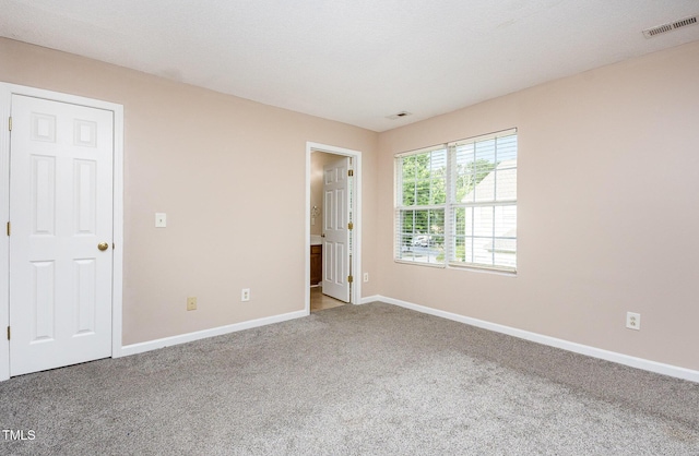 424 Nomar, Raleigh, NC 27610 - unfurnished bedroom featuring carpet and baseboards