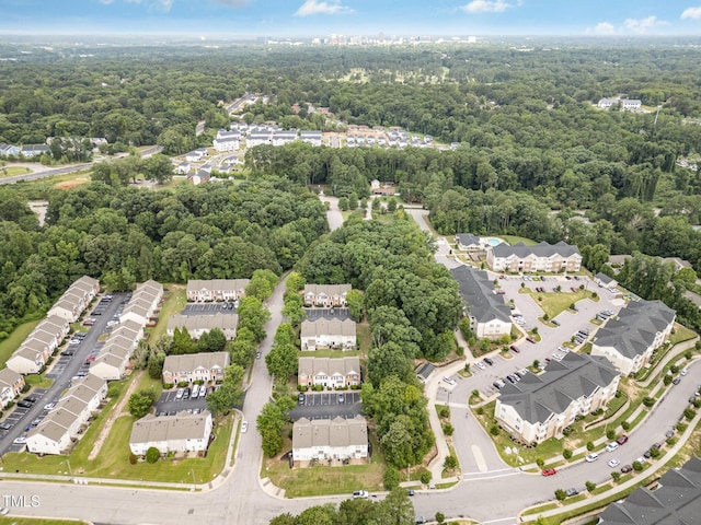 424 Nomar, Raleigh, NC 27610 - aerial overview of property's location with a heavily wooded area and nearby suburban area