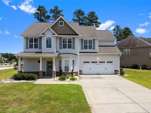 17 Tanawha Ct, Spring Lake, NC 28390 - craftsman inspired home with driveway, a front lawn, a garage, covered porch, and stone siding