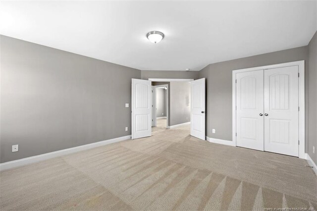 17 Tanawha Ct, Spring Lake, NC 28390 - unfurnished bedroom with a closet and light carpet