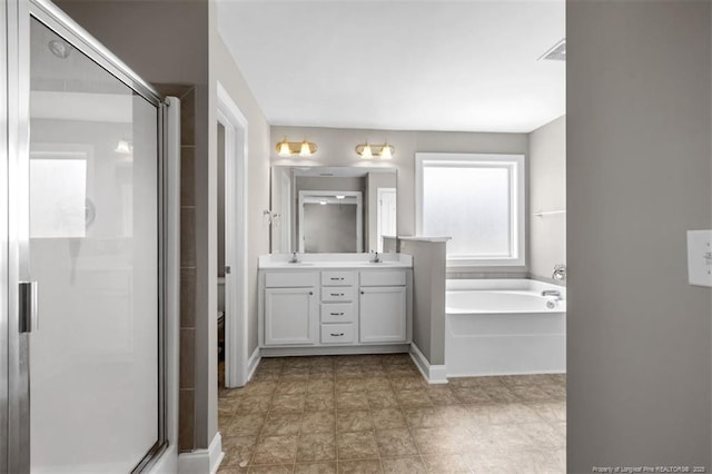 17 Tanawha Ct, Spring Lake, NC 28390 - full bathroom with double vanity, a shower stall, and a bath