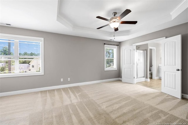 17 Tanawha Ct, Spring Lake, NC 28390 - unfurnished bedroom featuring a raised ceiling, crown molding, light colored carpet, and ceiling fan