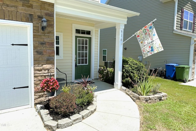 516 Smithridge Way, Fuquay Varina, NC 27526 - property entrance with covered porch and a yard