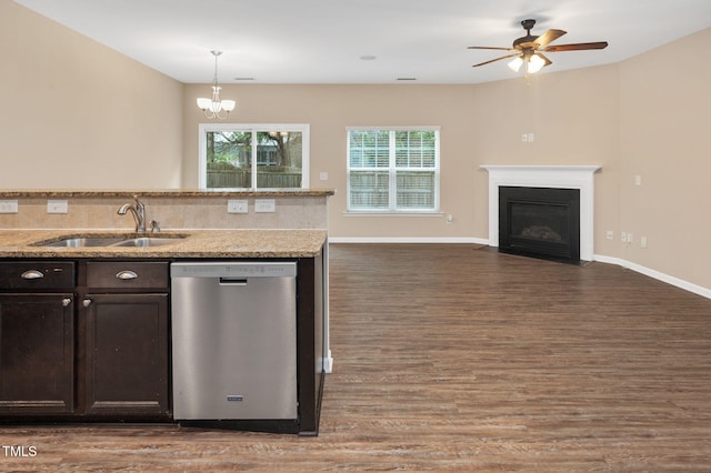 516 Smithridge Way, Fuquay Varina, NC 27526 - kitchen with dishwasher, open floor plan, dark brown cabinets, a fireplace with flush hearth, and dark wood-style floors
