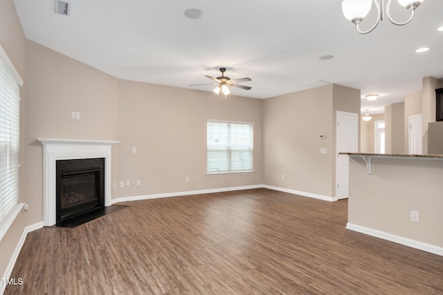 516 Smithridge Way, Fuquay Varina, NC 27526 - unfurnished living room featuring ceiling fan, dark wood-style floors, a chandelier, a fireplace with flush hearth, and recessed lighting