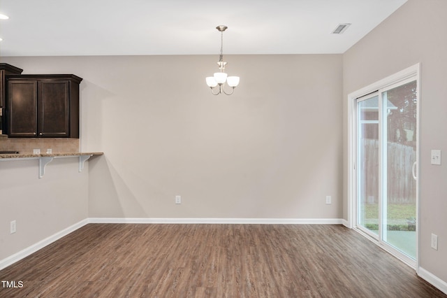 516 Smithridge Way, Fuquay Varina, NC 27526 - unfurnished dining area featuring dark wood-type flooring, a chandelier, and recessed lighting