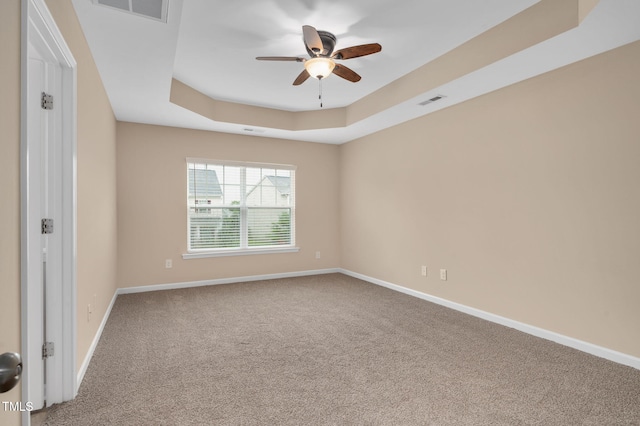 516 Smithridge Way, Fuquay Varina, NC 27526 - unfurnished room with a raised ceiling, a ceiling fan, and carpet