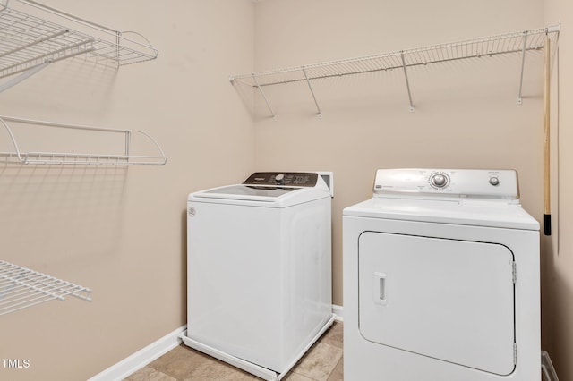 516 Smithridge Way, Fuquay Varina, NC 27526 - washroom with washing machine and clothes dryer and light tile patterned floors