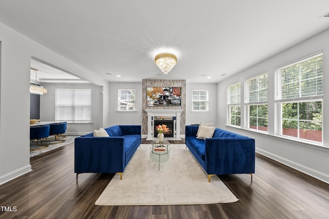 1705 Pointe Xing, Apex, NC 27523 - living area with healthy amount of natural light, dark wood-style flooring, a large fireplace, and recessed lighting
