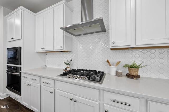 1705 Pointe Xing, Apex, NC 27523 - kitchen featuring wall chimney range hood, stainless steel appliances, light countertops, white cabinets, and tasteful backsplash