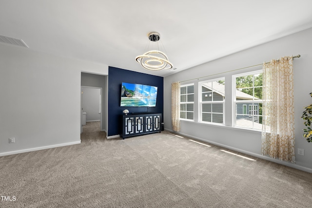 1705 Pointe Xing, Apex, NC 27523 - unfurnished living room with carpet floors and a chandelier