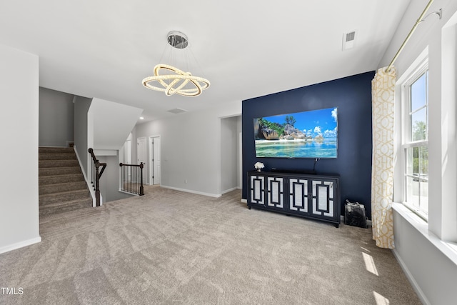 1705 Pointe Xing, Apex, NC 27523 - unfurnished living room with a chandelier and carpet