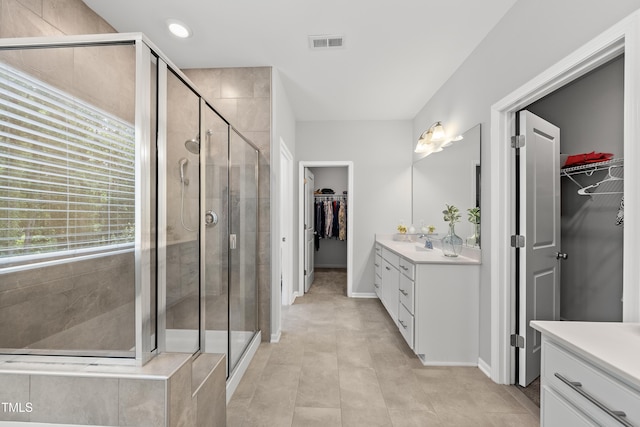 1705 Pointe Xing, Apex, NC 27523 - full bath featuring vanity, a walk in closet, and a stall shower