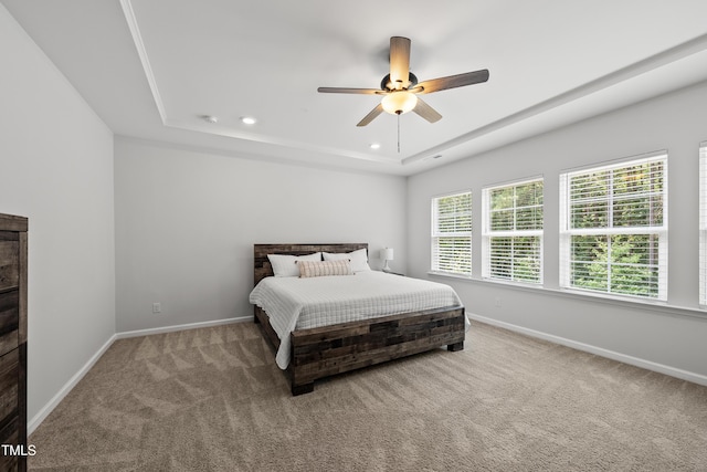 1705 Pointe Xing, Apex, NC 27523 - carpeted bedroom featuring a tray ceiling, recessed lighting, and ceiling fan