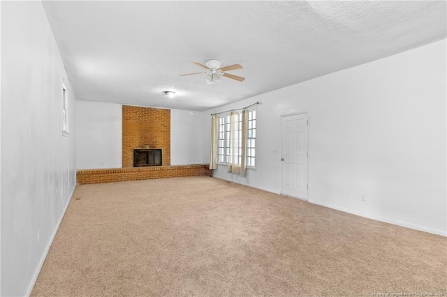 1109 Chesterfield Dr, Fayetteville, NC 28305 - unfurnished living room with ceiling fan, carpet floors, a textured ceiling, and a fireplace