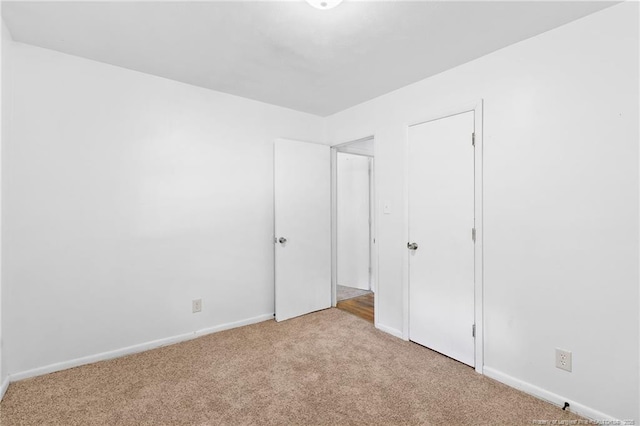1109 Chesterfield Dr, Fayetteville, NC 28305 - unfurnished bedroom featuring light colored carpet and baseboards