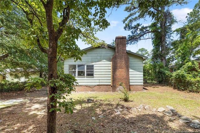 1109 Chesterfield Dr, Fayetteville, NC 28305 - view of side of property featuring a chimney