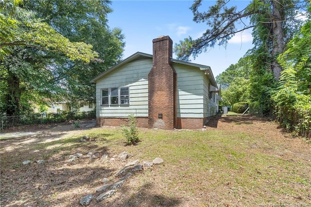 1109 Chesterfield Dr, Fayetteville, NC 28305 - view of home's exterior featuring a chimney