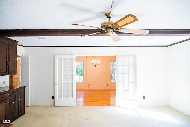 70 Sand Trap Ln, Roxboro, NC 27574 - empty room with a chandelier, a ceiling fan, light colored carpet, and beam ceiling