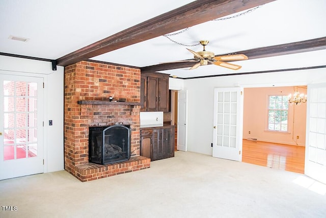 70 Sand Trap Ln, Roxboro, NC 27574 - unfurnished living room featuring light carpet, a chandelier, a ceiling fan, beam ceiling, and ornamental molding