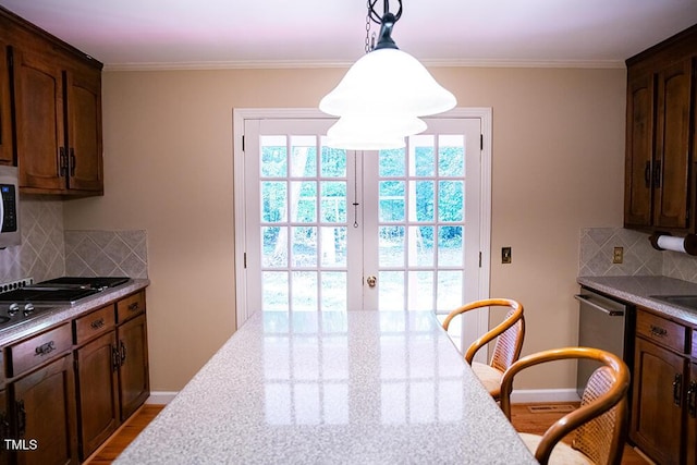 70 Sand Trap Ln, Roxboro, NC 27574 - kitchen with tasteful backsplash, french doors, hanging light fixtures, wood finished floors, and ornamental molding