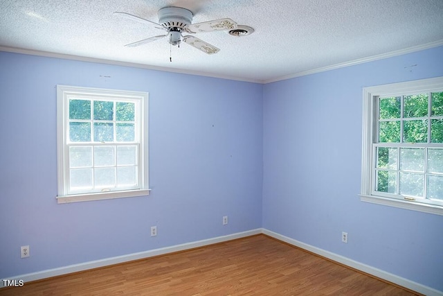 70 Sand Trap Ln, Roxboro, NC 27574 - empty room with a textured ceiling, wood finished floors, ceiling fan, and crown molding