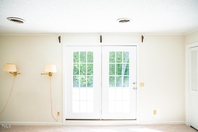 70 Sand Trap Ln, Roxboro, NC 27574 - doorway to outside featuring ornamental molding, carpet, and a textured ceiling