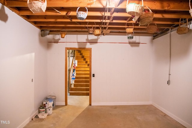 70 Sand Trap Ln, Roxboro, NC 27574 - below grade area featuring stairway and baseboards