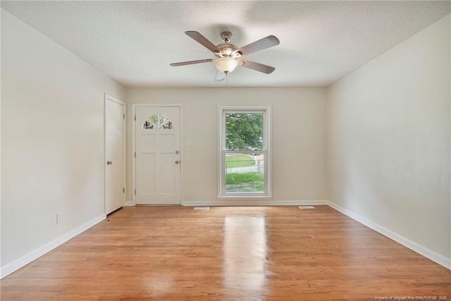 2619 Dumfries Dr, Fayetteville, NC 28306 - foyer entrance featuring a ceiling fan, light wood-type flooring, and a textured ceiling