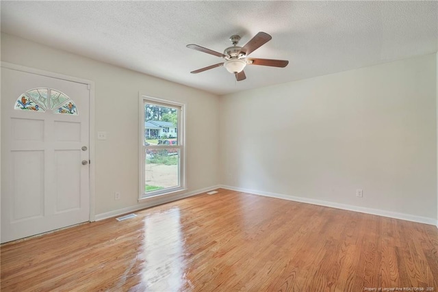 2619 Dumfries Dr, Fayetteville, NC 28306 - foyer entrance featuring light wood-style floors, a ceiling fan, and a textured ceiling