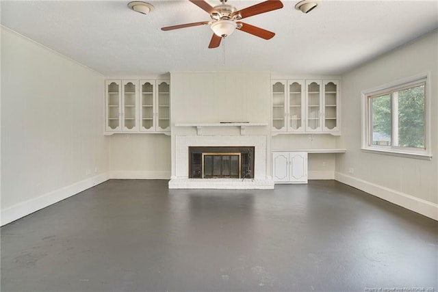 2619 Dumfries Dr, Fayetteville, NC 28306 - unfurnished living room with concrete flooring, ceiling fan, and a brick fireplace